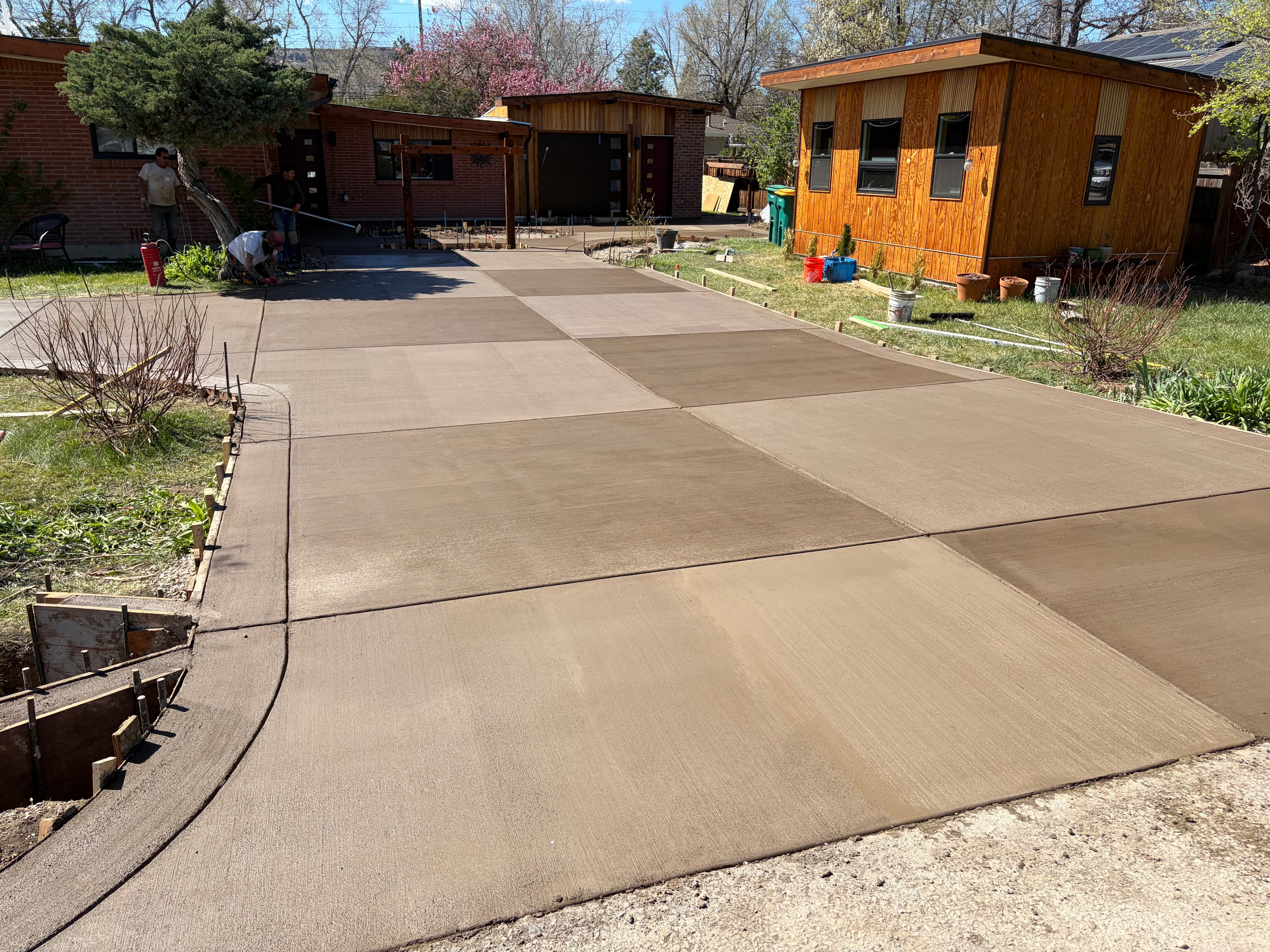 Wide concrete driveway pour with clean control joints