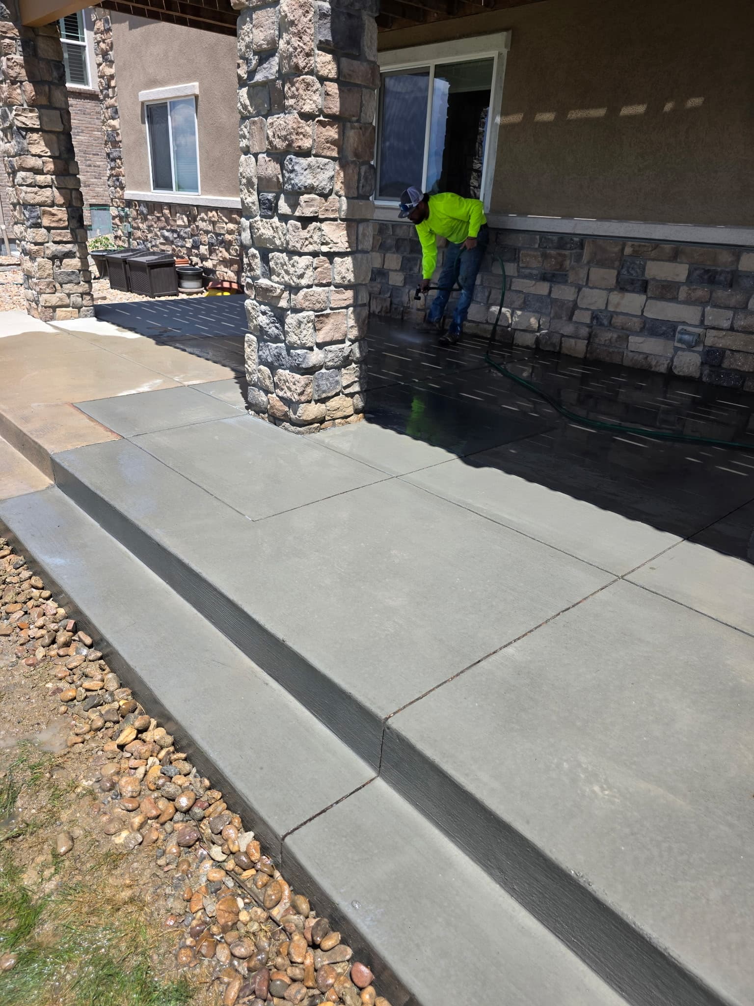Concrete patio sealed to a smooth, reflective finish